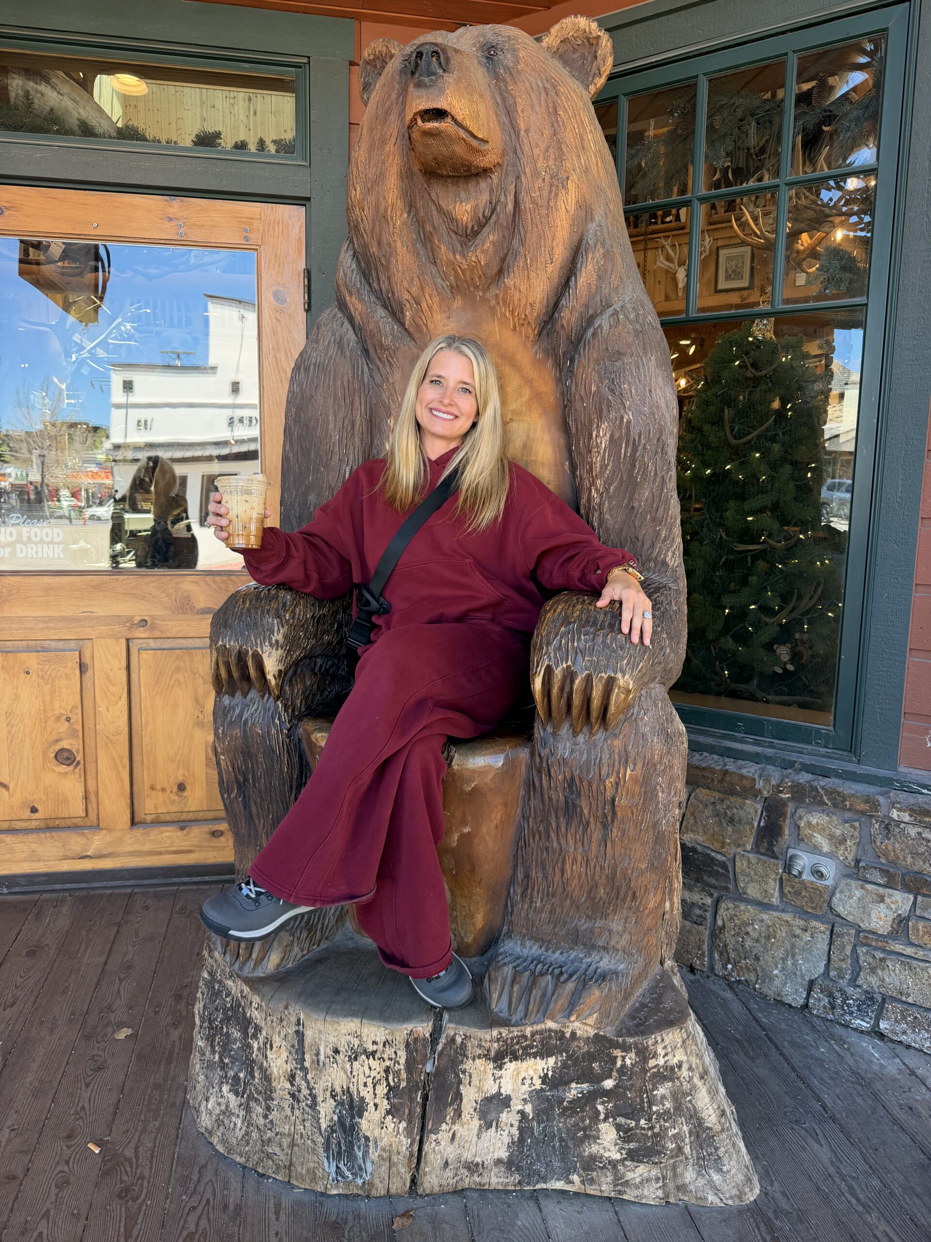 Posing with the iconic carved bear chair in downtown Jackson