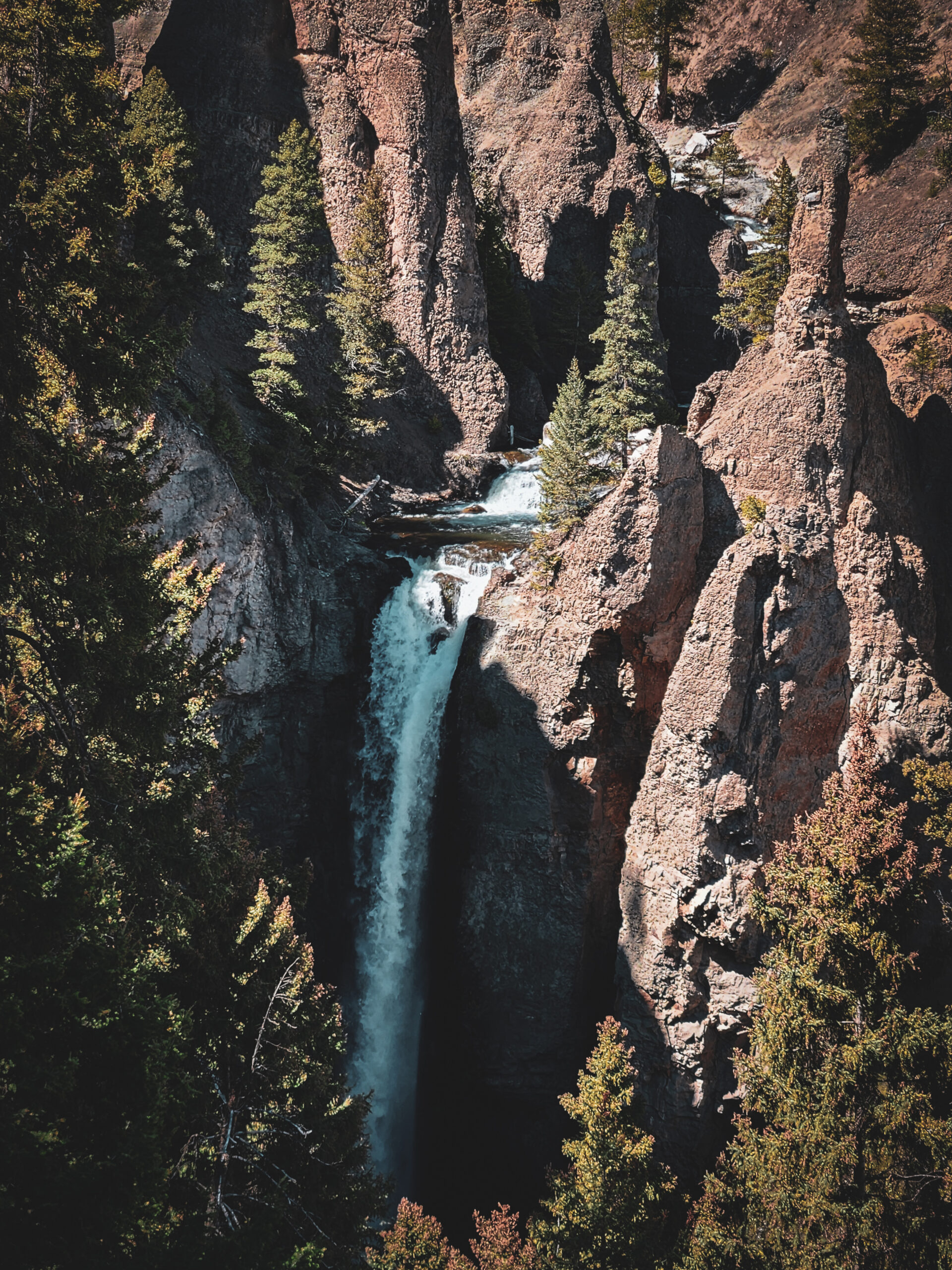 Tower Fall waterfall framed by volcanic rock spires in Yellowstone