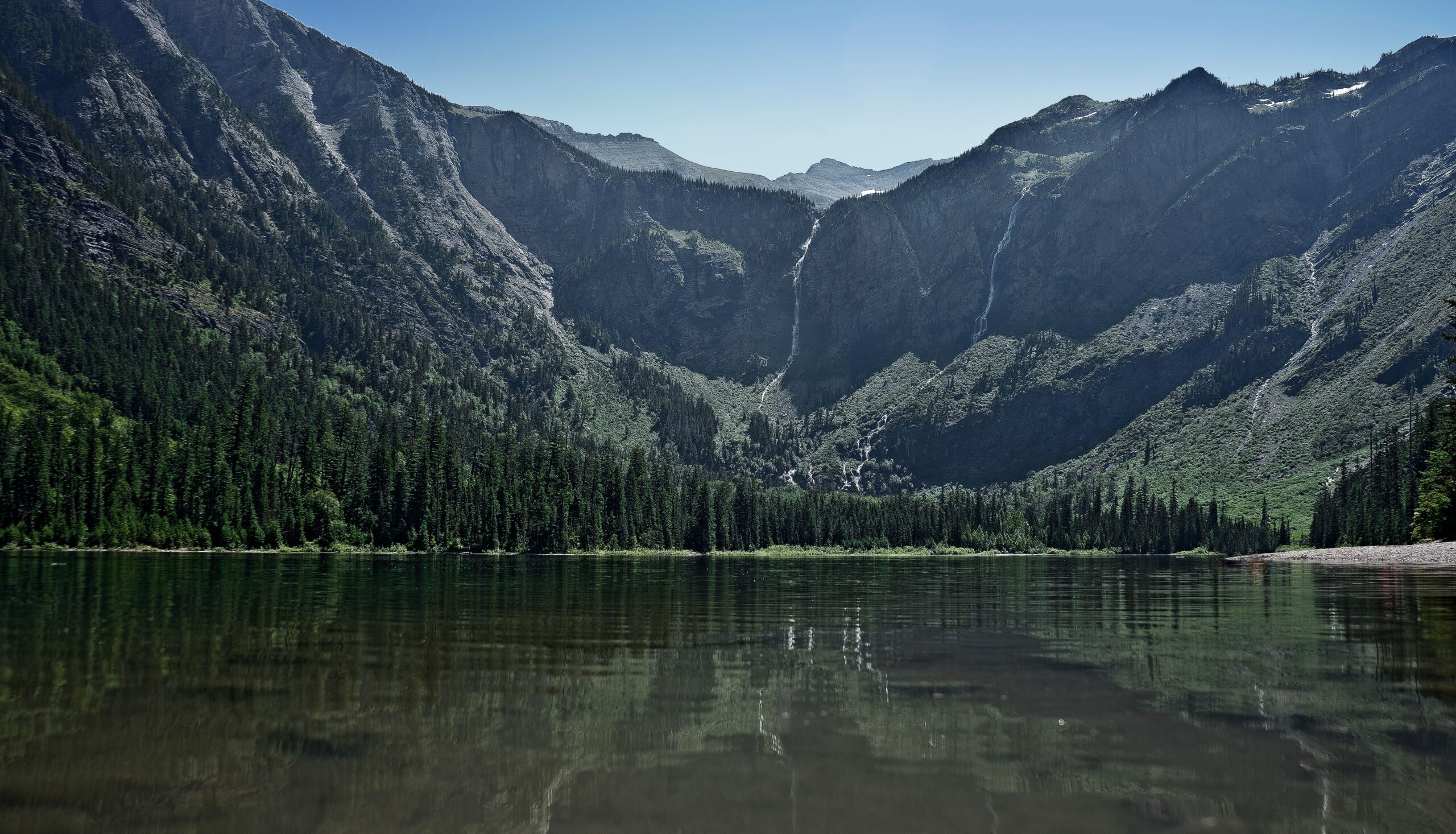 Avalanche Lake ringed by waterfalls in Glacier National Park